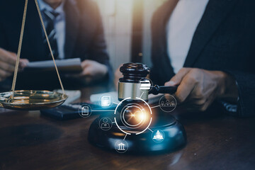 Business and lawyers discussing contract papers with brass scale on desk in office. Law, legal services, advice, justice and law concept picture with film grain effect