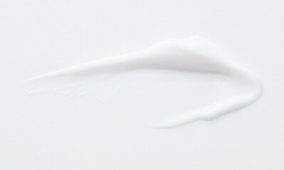 White cream swipe isolated on white background.