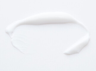 White cream swipe isolated on white background.