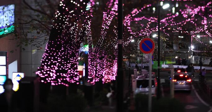 A night illuminated street in Shibuya long shot
