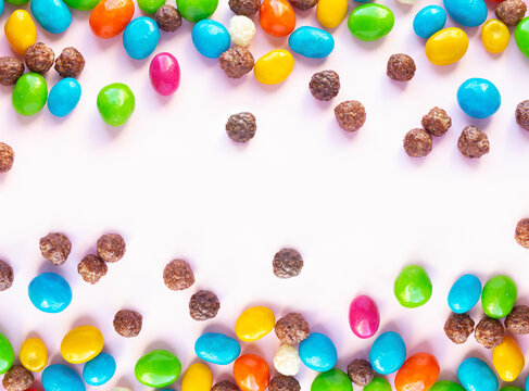 Frame of chocolate and jellybeans candy background top view