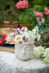 summer flowers in the Buddha vase