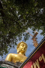 Phasi Charoen district,Bangkok,Thailand on May29,2020:Big golden Buddha statue named "Phra Buddha Dhammakaya Thepmongkhon" (under construction)