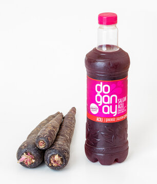 03 June 2022, Antalya, Turkey: Popular turkish traditional beverage Salgam or Shalgam, made from fermented juice of turnip and black carrots roots