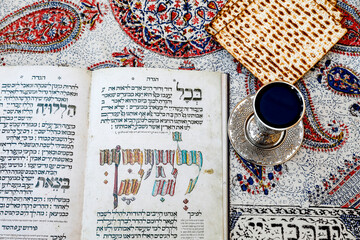 Passover Seder Haggadah in a Jerusalem jewish home, with wine and matsa..