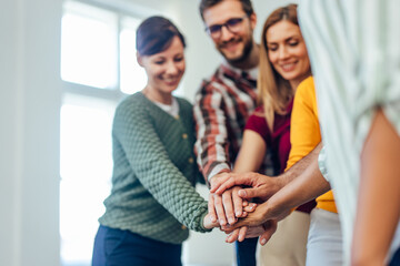 Focus on the people's hands, holding them together in the middle.