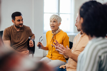 The exited-looking mature woman told her life story, during the group therapy.