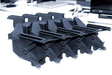 Models printed on 3D printer isolated on white background. Objects details printed on 3D printer...