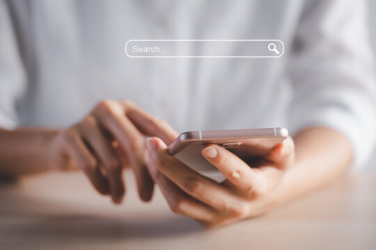 closeup woman hands using smart phone with search tab icon