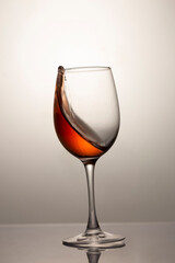 falling glass with red wine, motion blur, blur