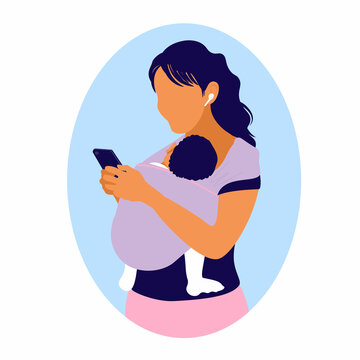 Woman uses a smartphone while holding a baby in a kangaroo bag. Mom wearing child in a sling. Mother's free hands. Newborn laid back nursing care. 