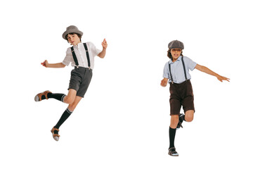 Fototapeta na wymiar Two school age boys, stylish kids wearing retro clothes isolated over white background. Concept of childhood, vintage summer fashion style