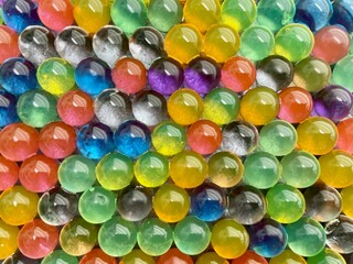 Fototapeta na wymiar Aerial view of water beads, colored hydrogel balls.