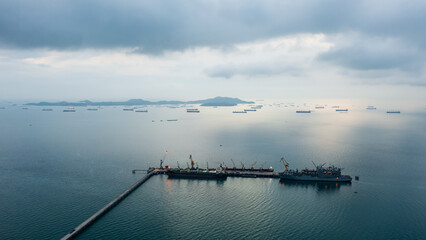 floating drilling platform on the ocean at evening in rainy season aerial view,.