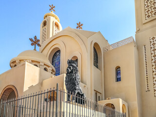 Sharm El Sheikh, Egypt - January 18, 2020: Sculpture of a lion with a crown at the entrance to the El sama Eyeen Coptic Church in Sharm El Sheikh. Exterior decor of Egyptian Orthodox Cathedral