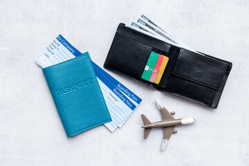 Wallet with money cash and travel tickets in passport