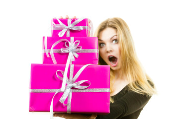 Shocked woman holding gifts
