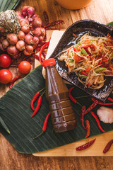 Various fresh vegetables and spices on wooden table