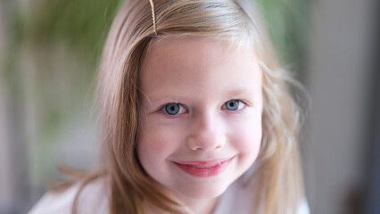 Portrait of beautiful little child girl with blue eyes