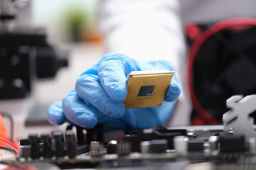 Technician put processor on computer motherboard socket