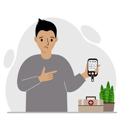 Sad man holds a glucometer in his hand. The concept of blood sugar control, diabetic.