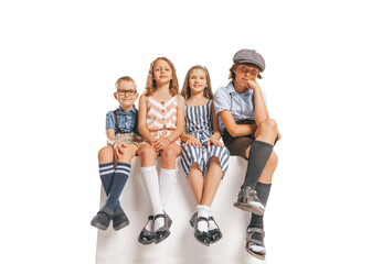 Group of cheerful kids in retro style summer outfit isolated on white background. Concept of art, friendship, hope, youth, fashion