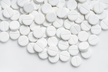 Heap of white pill on white background