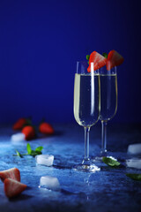 Two glasses of champagne with strawberry