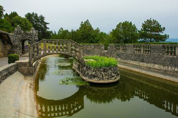Fototapeta premium The pond in the Ferrari Garden in Stanjel village in Komen municipality, Primorska region, western Slovenia 