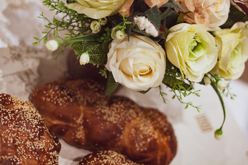Flowers and Challah braided bread for Shabbat