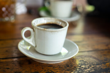Black coffee on wooden table