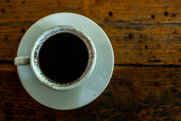 Black coffee on wooden table