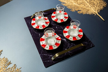 Empty tea glasses on tray