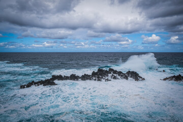 Porto Moniz - rocks and waves at storm - beautiful landscape scenery of Madeira Island, Portugal. October 2021
