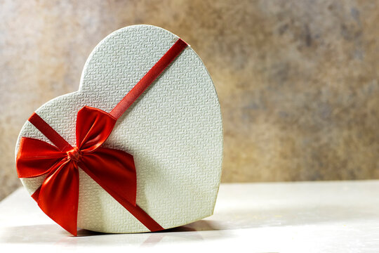 closed heart shaped box isolated on marble background. holidays concept