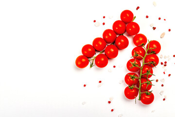 Cooking background with tomato cherry, sea salt, and rose peppercorn isolated on white background