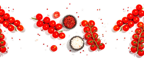 Cooking background with tomato cherry, sea salt, and rose peppercorn isolated on white background