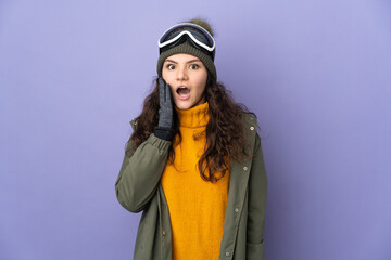 Teenager Russian girl with snowboarding glasses isolated on purple background with surprise and shocked facial expression