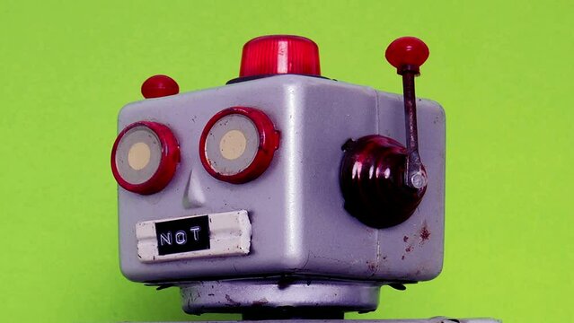 little robot head  I AM NOT A ROBOT on green 