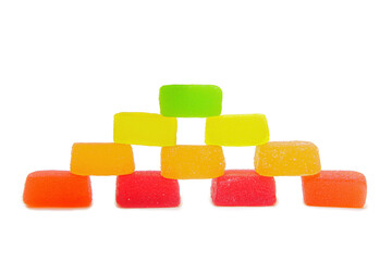 Pyramid made from marmalade cubes on white