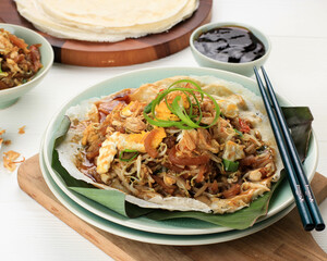 Lumpia Basah Bandung, Popular Traditional Street Food Snack Made from Thin Wrapper with Saute Spicy Soy Bean Sprout and Bamboo Sprout, add with Sticky Sweet Paste from Starch