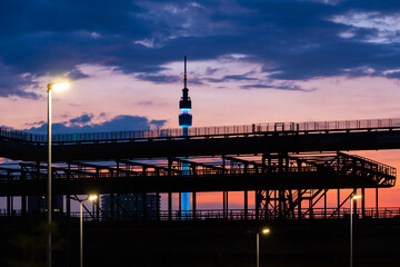 Panorama of Dortmund Germany with TV-Tower and steel construction. after colorful Sunset summer. Blue hour twilight with silhouettes of pipes, tubes and framework of historic blast furnace factory. - obrazy, fototapety, plakaty