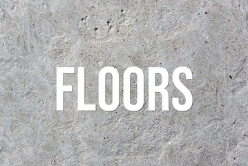 FLOORS - word on concrete background. Cement floor, wall.