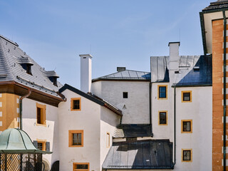 Fototapeta na wymiar Beautiful facade of the old fortress in Salzburg with windows, Austria