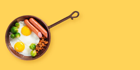 Breakfast - egg, sausage, haricot,  Brussels sprout on a yellow background. Banner. The top view. Copy space
