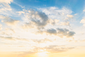 Obraz premium Sky blue and orange light of the sun through the clouds in the sky