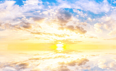 Fototapeta na wymiar Sky blue and orange light of the sun through the clouds in the sky