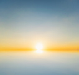 Fototapeta premium Sky blue and orange light of the sun through the clouds in the sky