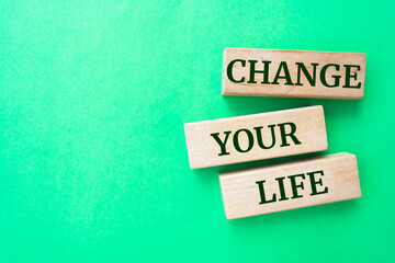 Wooden blocks with words 'Change your Life'.