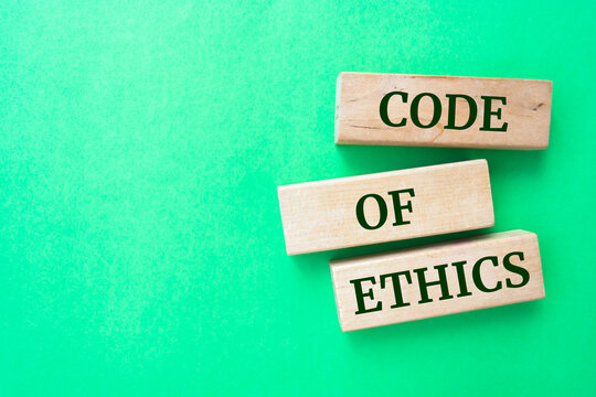 Wooden blocks with words 'CODE OF ETHICS'.